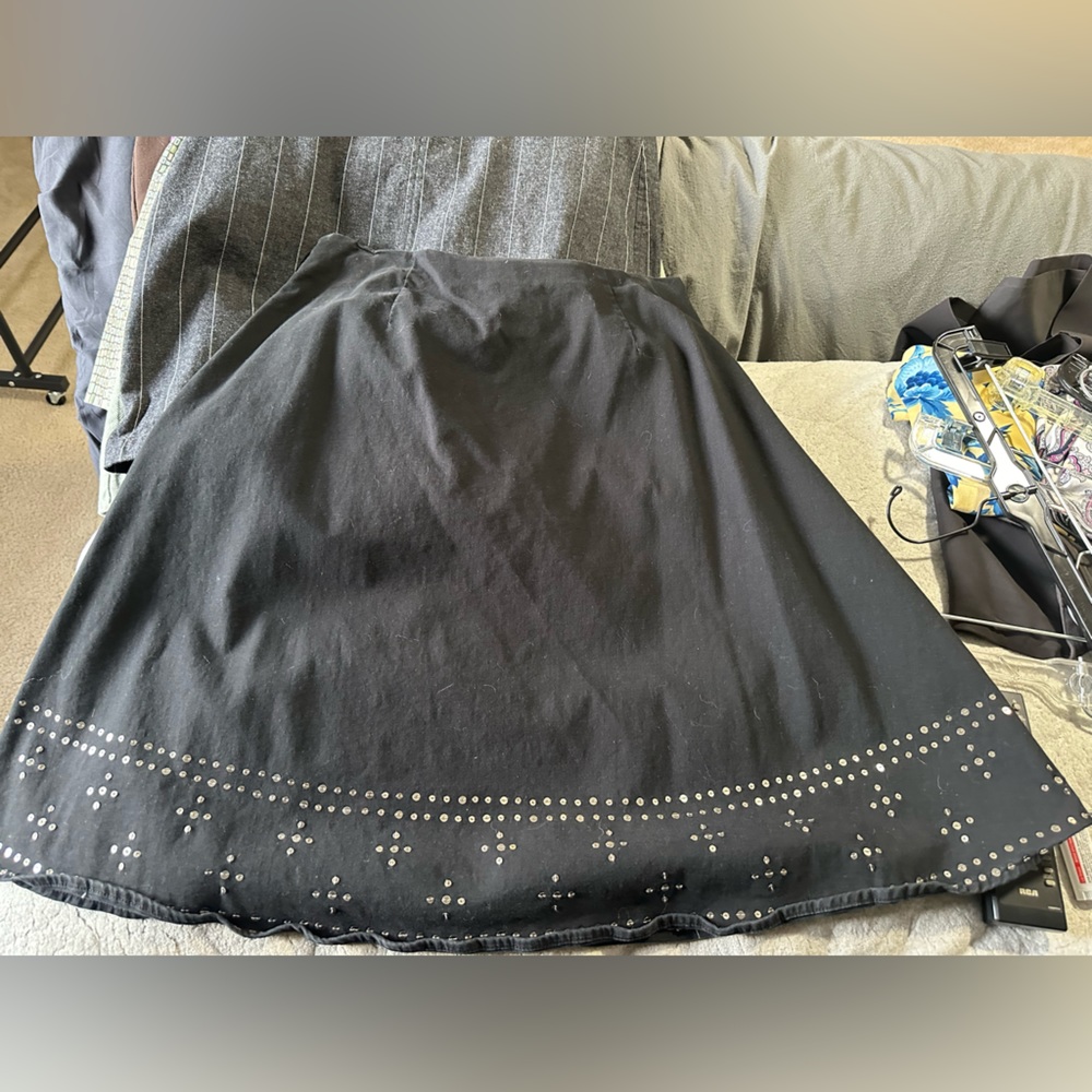Adorable A-line black skirt with fun detailing on bottom